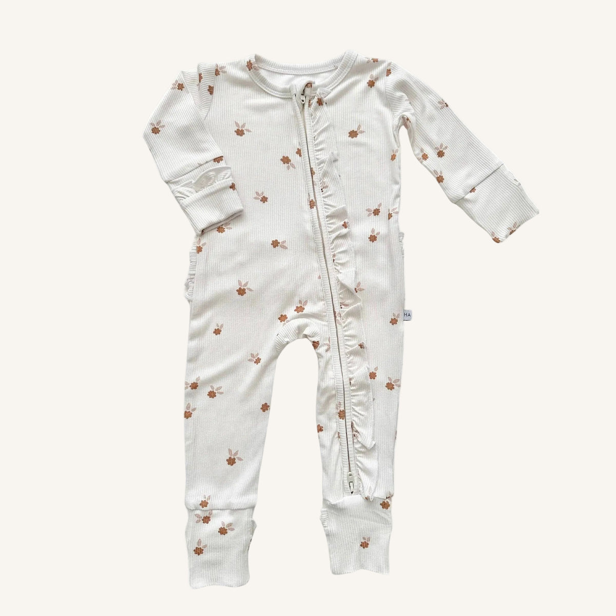 Baby onesie with floral pattern on a white background