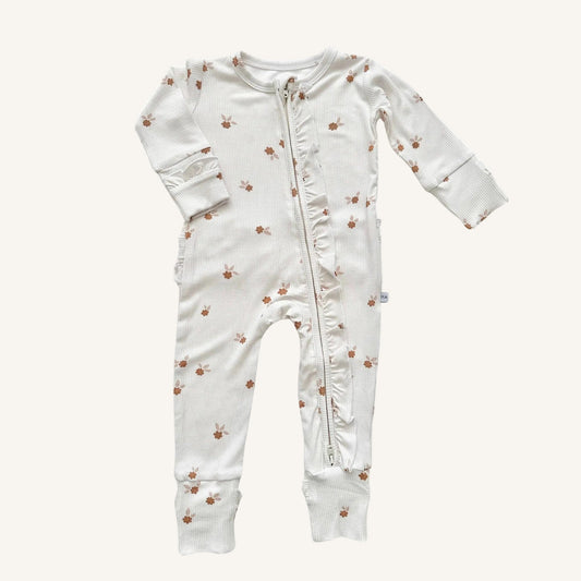 Baby onesie with floral pattern on a white background