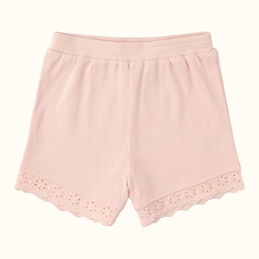 Pink ribbed shorts with eyelet lace trim on a white background