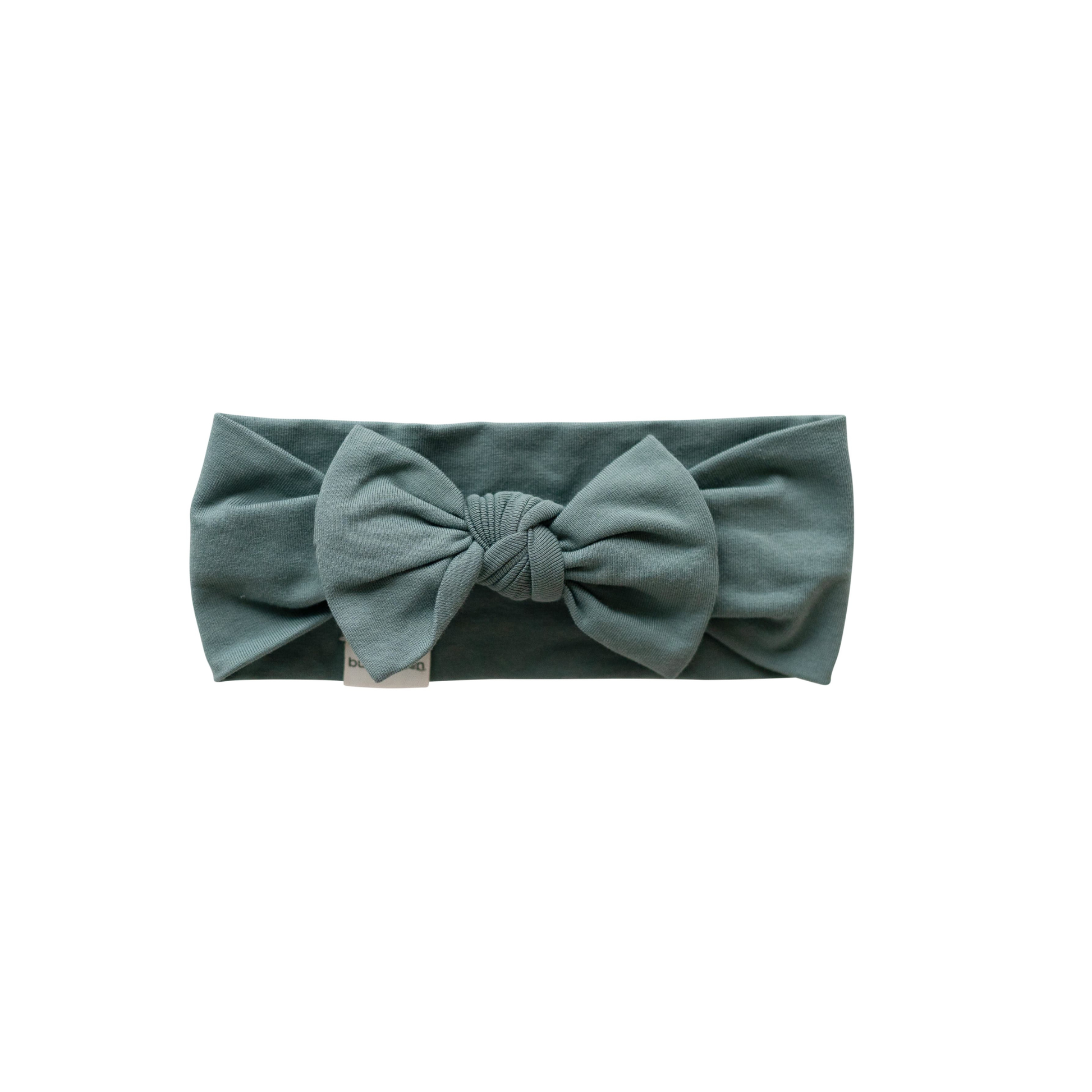 green headband on a white background