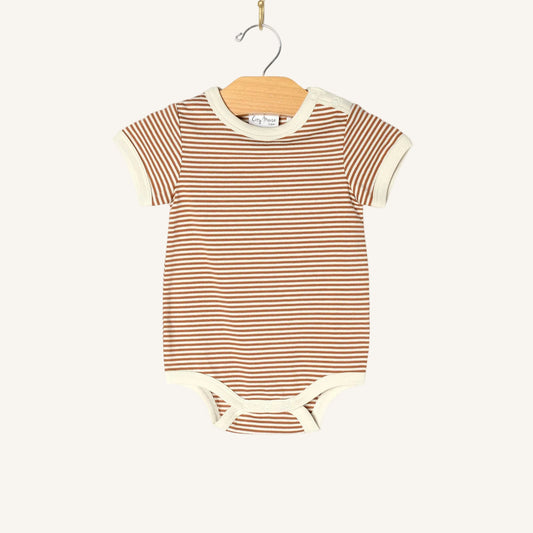 Striped baby bodysuit on a hanger against a white background