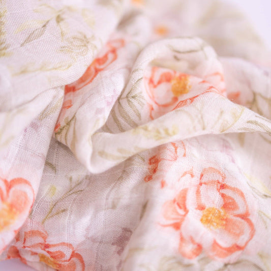 Floral patterned fabric with pink flowers on a light background