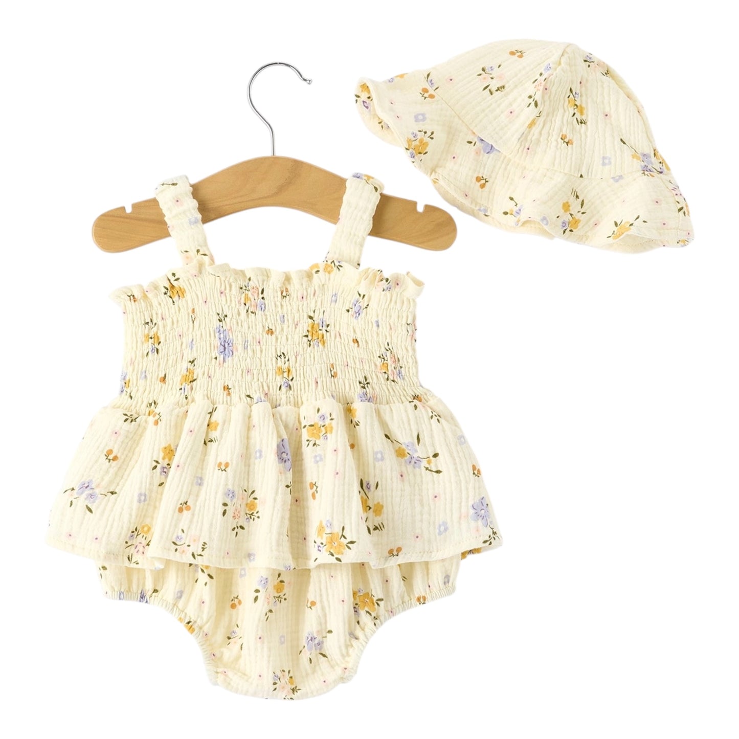 Baby romper with floral pattern and matching hat on a hanger against a white background
