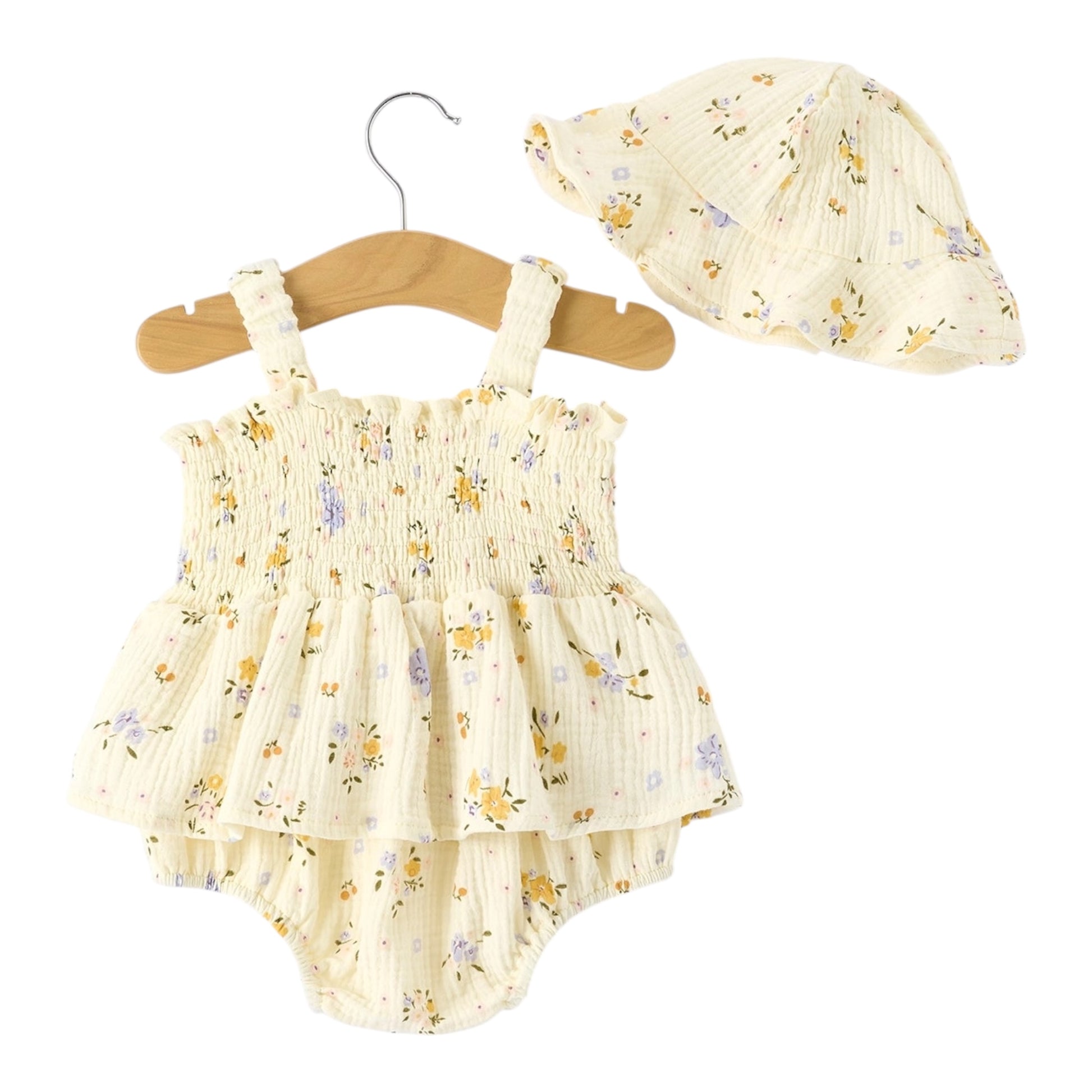Baby romper with floral pattern and matching hat on a hanger against a white background
