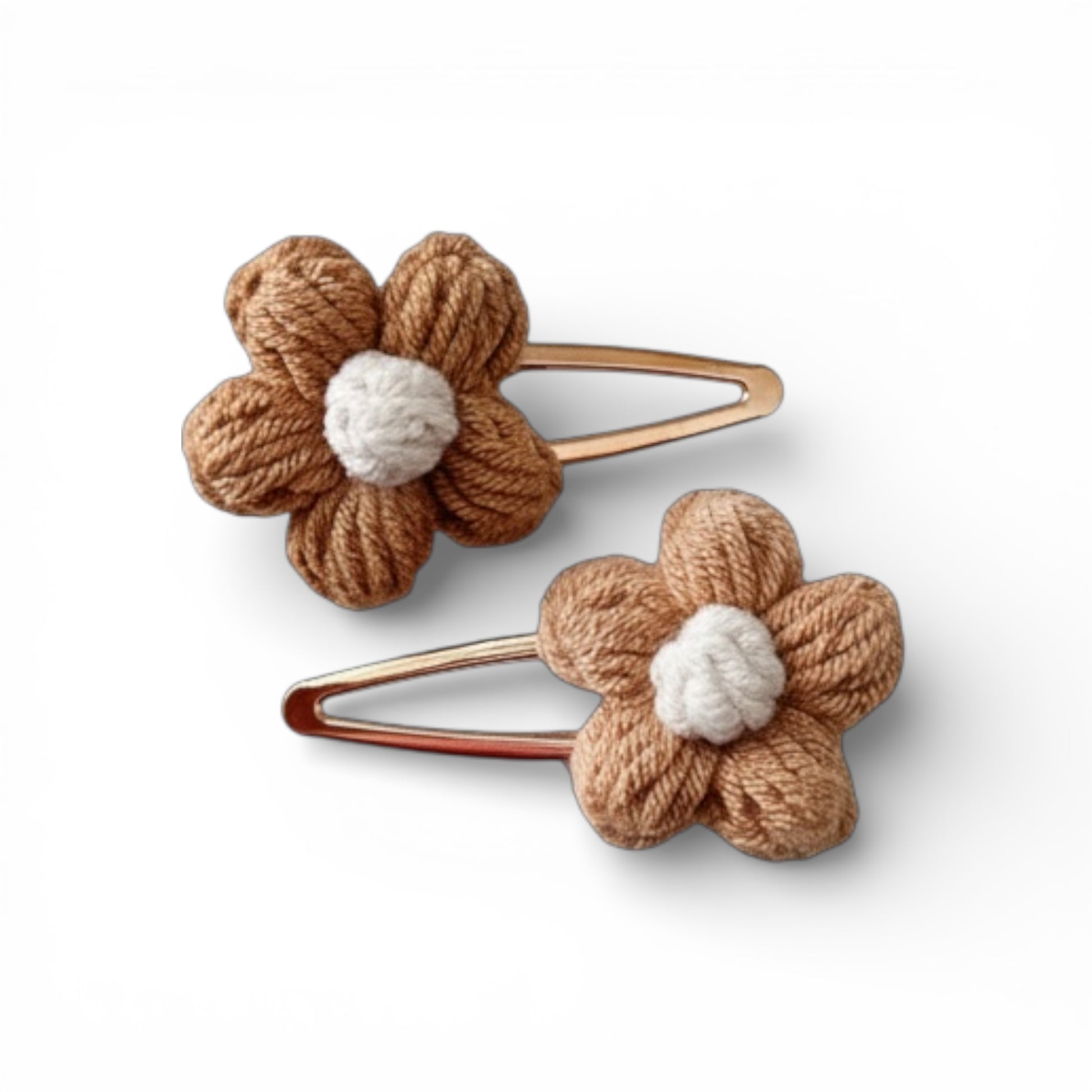 Two brown flower-shaped hair clips with white centers on a white background