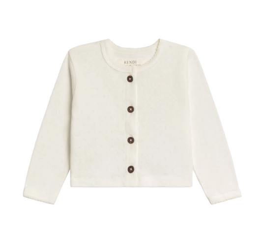 White cardigan with brown buttons on a white background