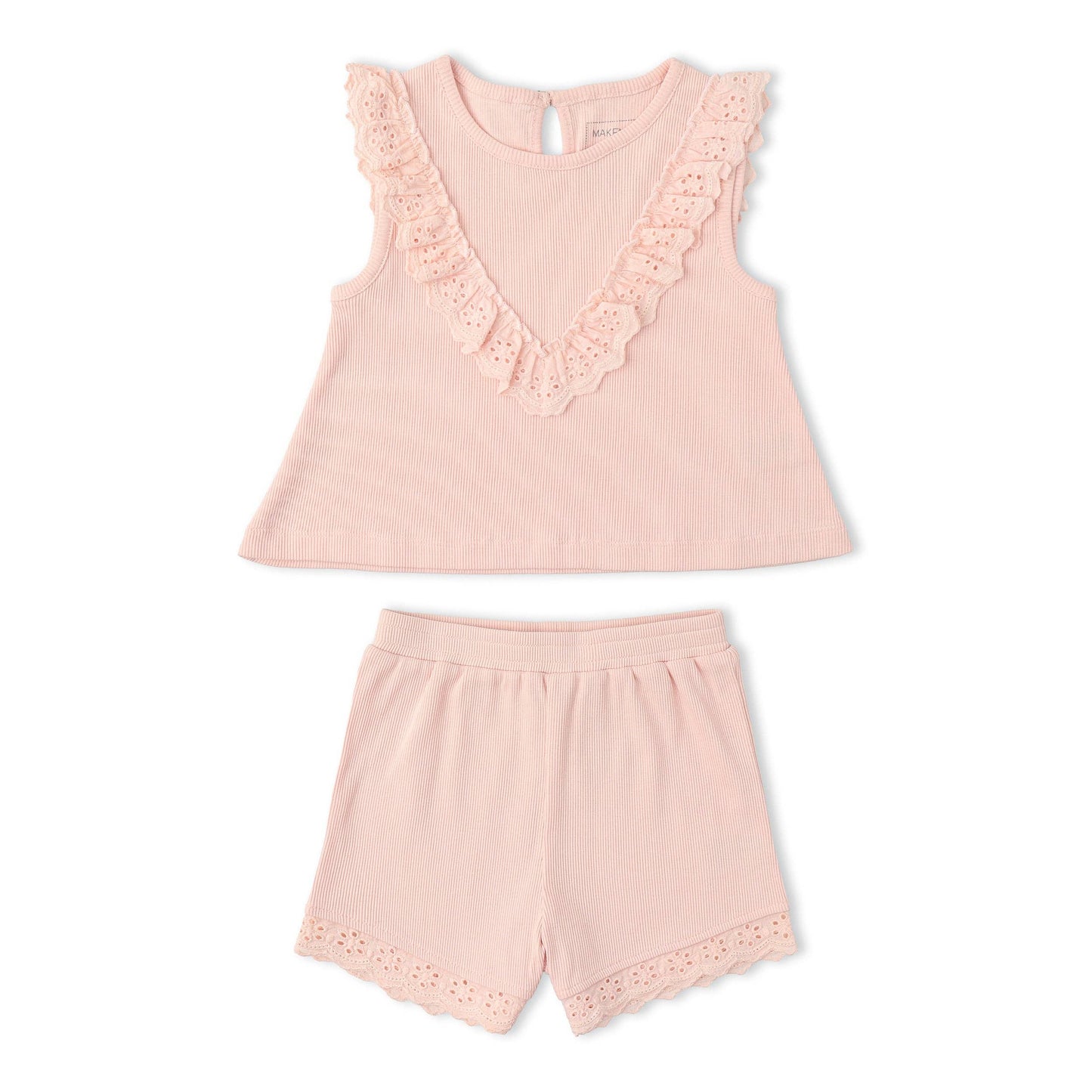 Pink ruffled top and eyelet shorts set with a white background