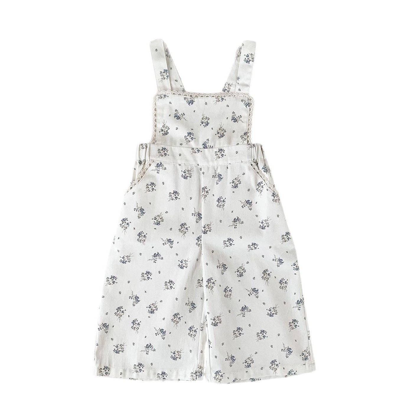 Floral-patterned overalls on a white background