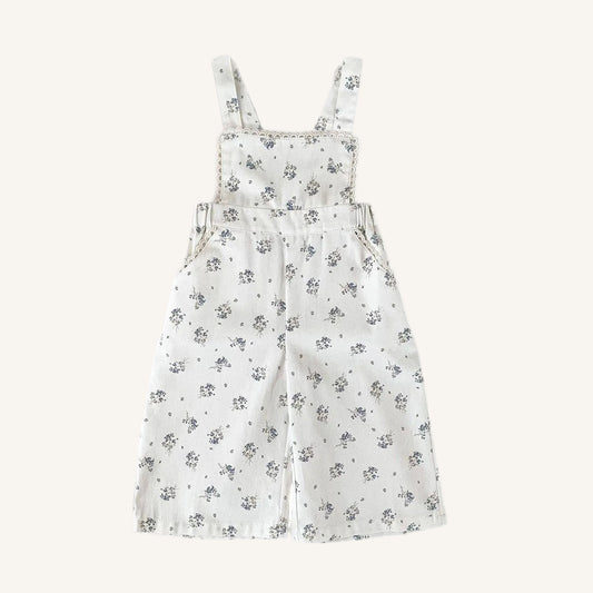 Floral-patterned overalls on a white background