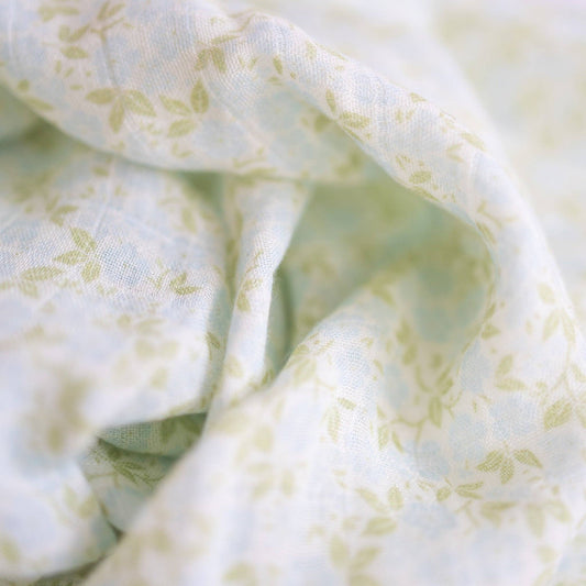 Close-up of light green fabric with subtle pattern
